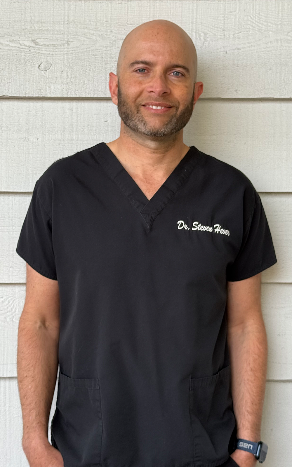 Dr. Steven in his office. Dr. Steven in his office.
